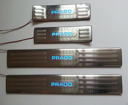 Накладки на пороги с подсветкой внутрисалонные LC150 (нержавеющая сталь)
